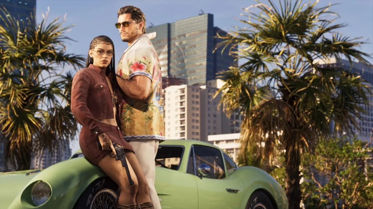 Lucia and Jason beside a green sports car