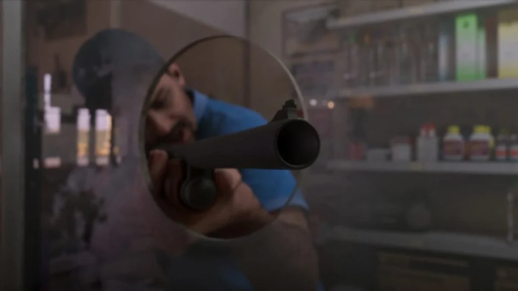 A store owner aiming a shotgun from a shop entrance